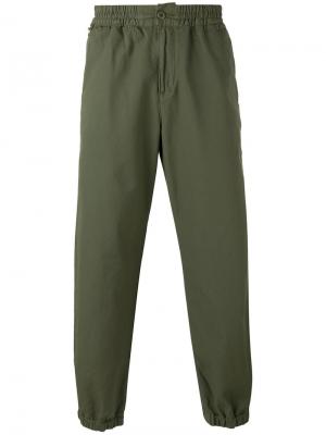 Укороченные спортивные брюки Carhartt. Цвет: зелёный