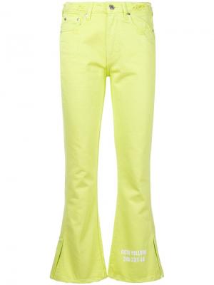 Расклешенные джинсы с эффектом потертости MSGM. Цвет: жёлтый и оранжевый