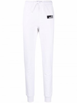 Спортивные брюки с нашивкой-логотипом Love Moschino. Цвет: белый