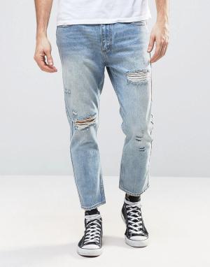 Укороченные джинсы слим с рваной отделкой и заплатками Stubs Rollas. Цвет: синий