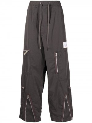 Decorative zip-detail wide leg trousers Maison Mihara Yasuhiro. Цвет: зеленый