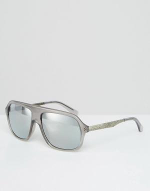 Солнцезащитные очки-авиаторы в серой оправе Calvin Klein. Цвет: серый