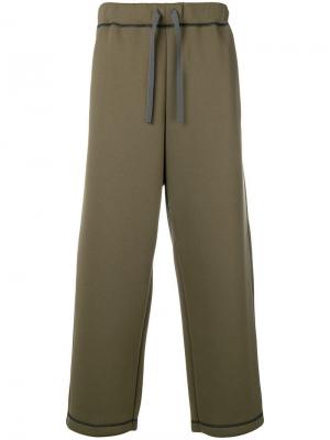 Классические спортивные брюки Digawel. Цвет: зеленый