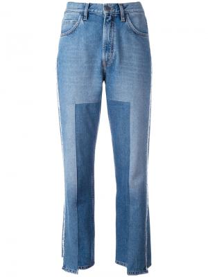 Укороченные асимметричные джинсы Mih Jeans. Цвет: синий