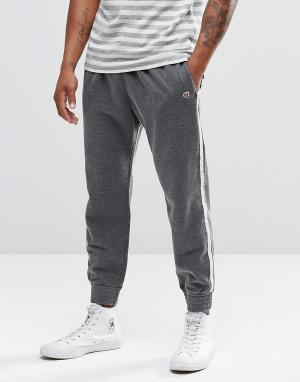 Светло-серые зауженные спортивные брюки с полосами по бокам Abercrombi Abercrombie & Fitch. Цвет: серый